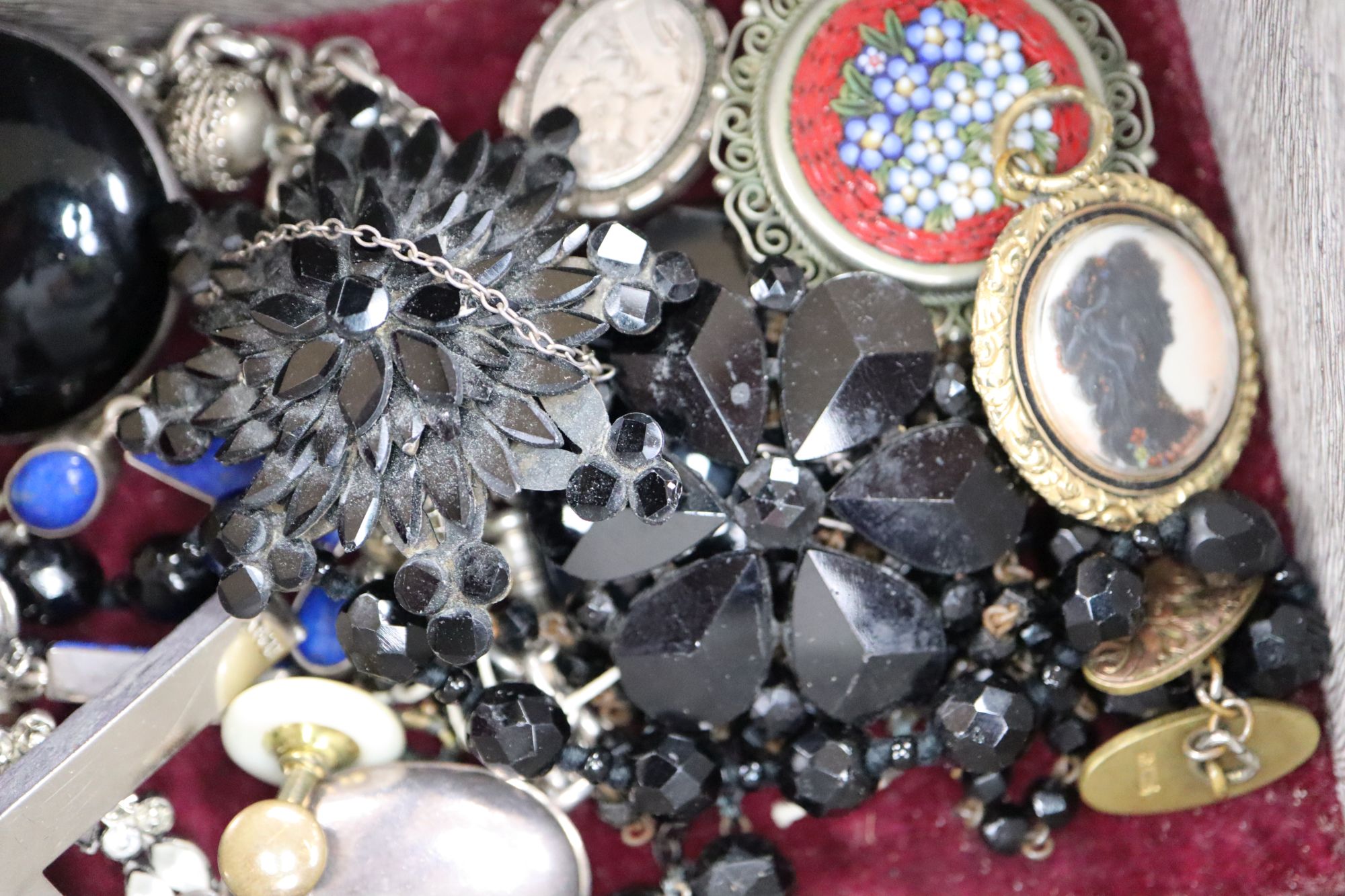 A small quantity of mixed jewellery, including a white metal locket on chain, a white metal and lapis lazuli bracelet, etc.